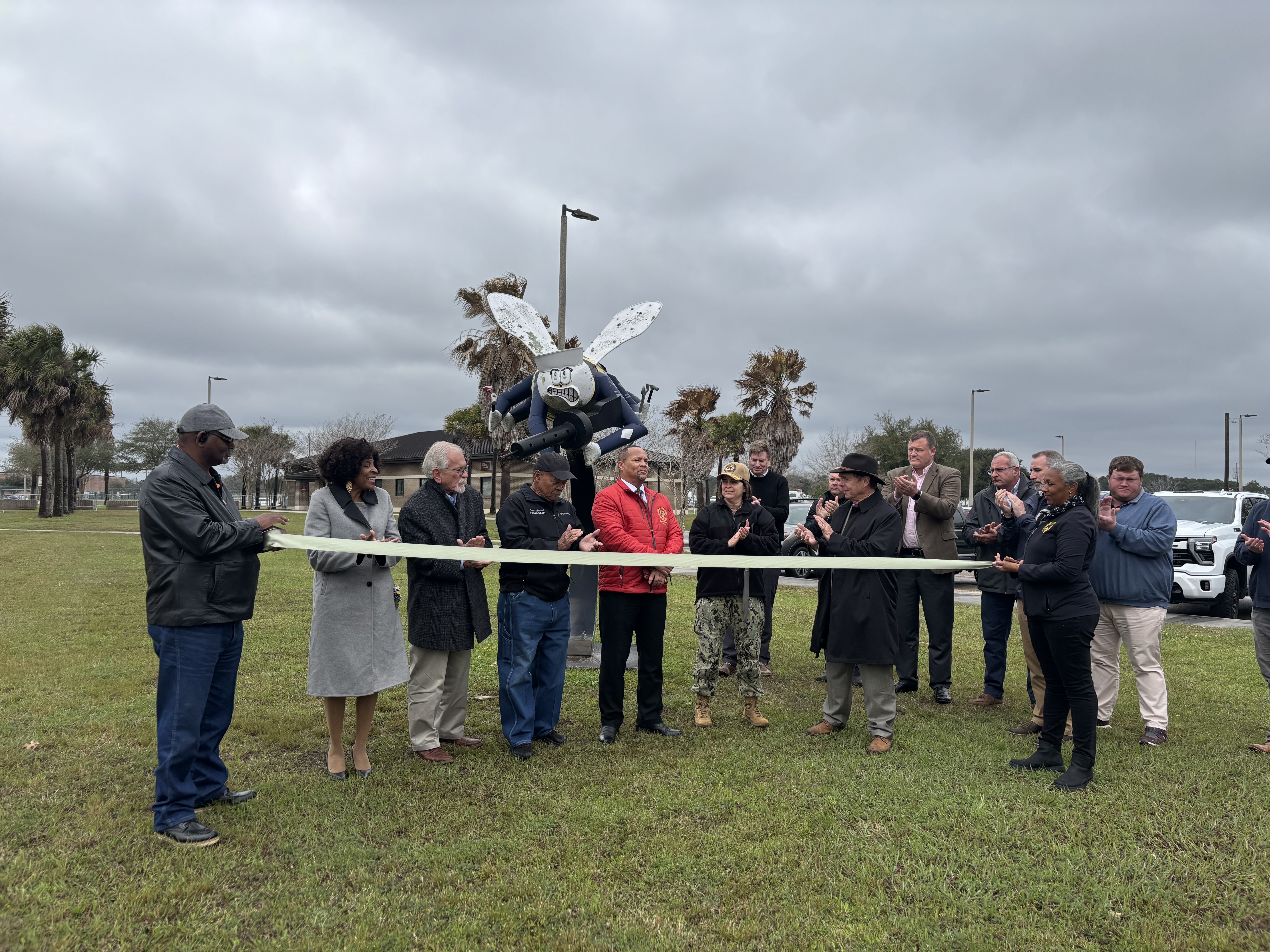 City and County Officials cutting the ribbon on the newly paved road